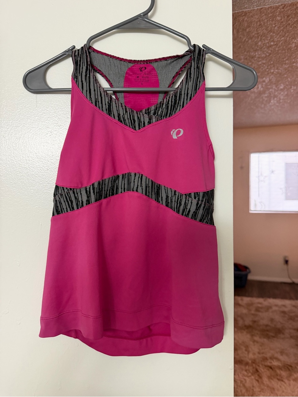 Pearl Izumi Women's Pink Racerback Cycling Jersey with Black Patterned Accents